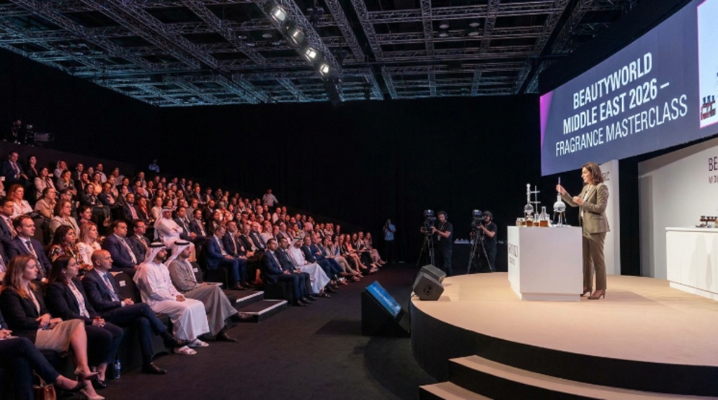 A live fragrance masterclass demonstration on stage at Beautyworld Middle East 2026, with industry professionals observing in the audience