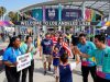LA28 Olympics volunteers welcoming fans at a Los Angeles Olympic venue.