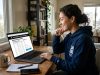 Fan viewing LA28 Olympic ticket prices and registration information on a laptop