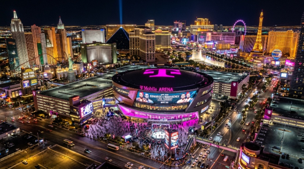 Aerial view of T-Mobile Arena on the Las Vegas Strip lit up for UFC 335 on the night of December 12 2026