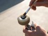 Skateboard wheels rolling across rough Austin pavement