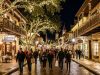Historic downtown St. Augustine street covered in millions of white holiday lights at night