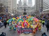Colorful Mummers performers in feathered costumes marching along Broad Street in Philadelphia on New Year's Day 2027